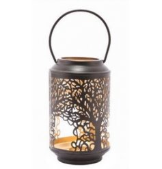 A beautifully detailed metal lantern, featuring a cut out tree decal and added block gold inner tone 