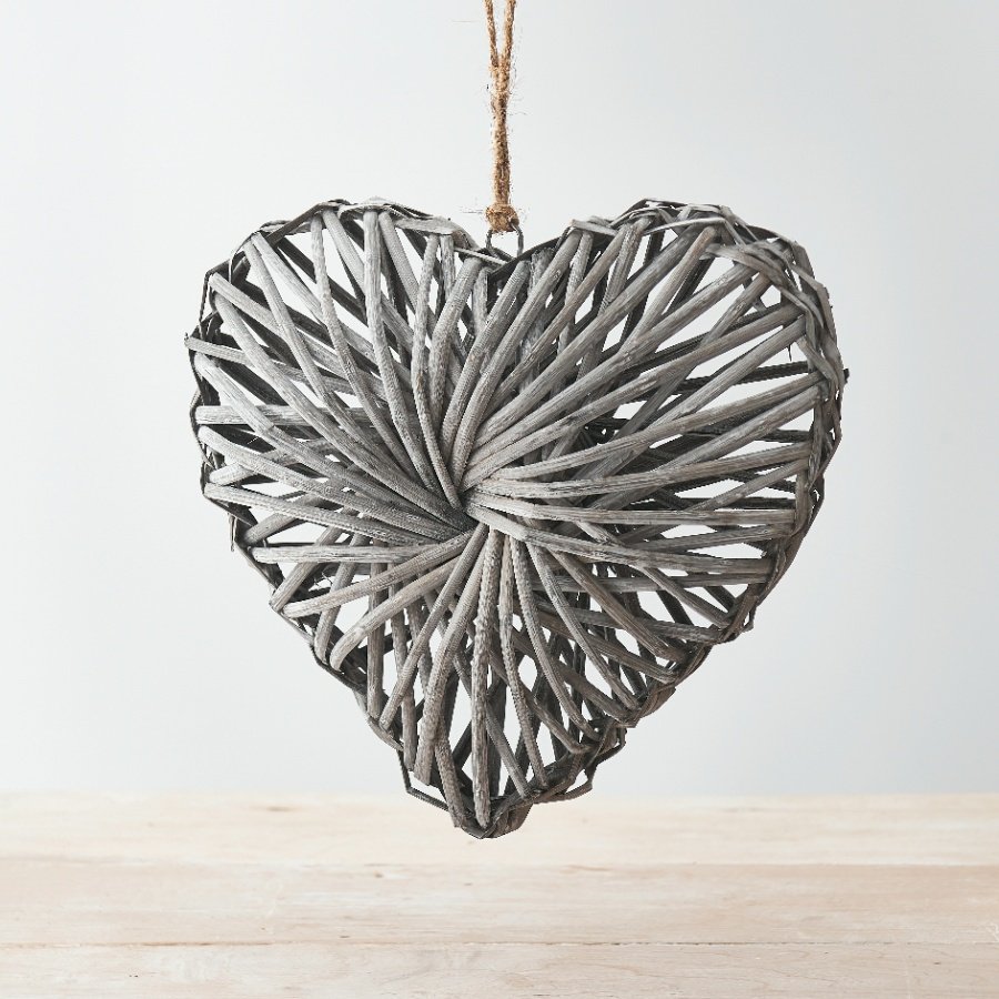A rustic living rattan heart wreath with a grey washed finish and stylish jute string hanger.