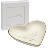 A sleek and simple heart shaped trinket dish complimented with a golden trim and added script text 