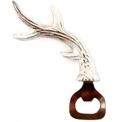 A simple bottle opener with a silver toned antler shaped handle 