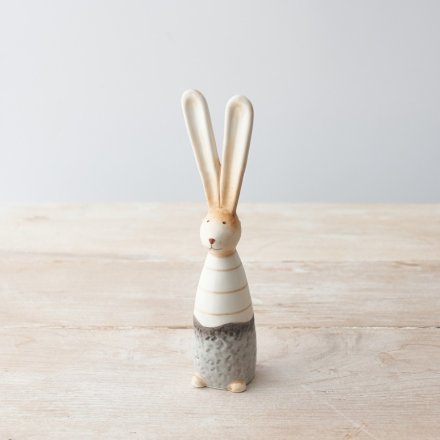 A charming ceramic bunny with a rustic finish. Complete with a chic stripe outfit and pointed ears.