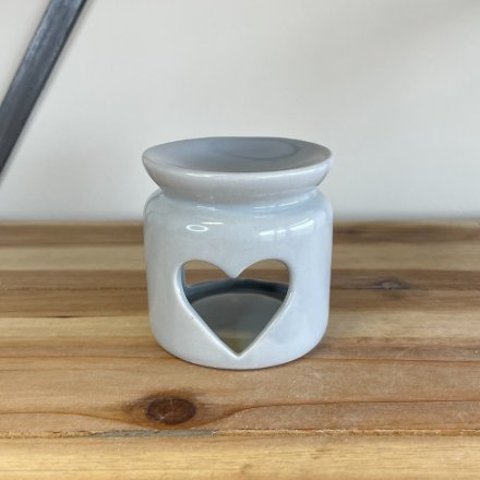 A chic and contemporary ceramic oil burner with a stylish heart shaped cut out design. 
