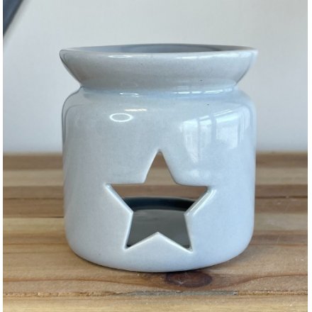 A small and simple grey toned ceramic oil burner with a star cut window 