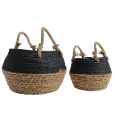 A set of 2 woven baskets in black and natural colours. Complete with rope handles and plastic lining.