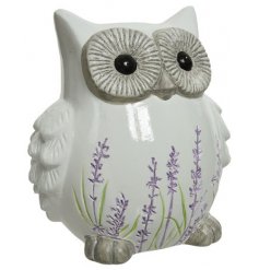  Set with an embossed lavender decal and smooth glaze finish, this terracotta based owl ornament is a must have in the h