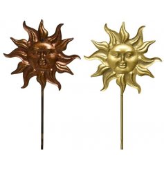 An assortment of 2 bronze and gold sun shaped iron stakes for the garden. 