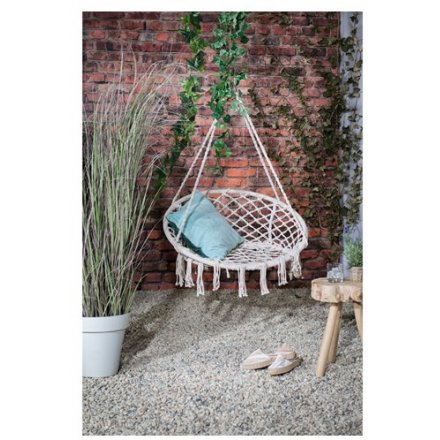 A bohemian hammock swing chair in natural. Complete with fringing. 
