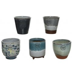 A mix of 5 beautifully glazed terracotta pot planters. Each has a unique design and a handmade aesthetic. 