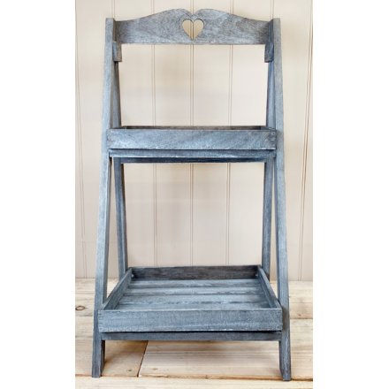  A natural wooden 2 Tier A-Frame Display Stand set with a rustic grey washed tone to it and a small heart cut decal on t