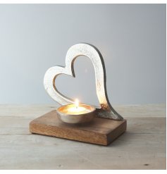 Sure to bring a delightful country charm feel to any home space, an aluminium heart on wood base, complete with an added
