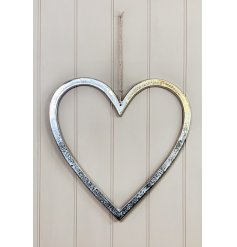 A large and simplistic ornamental heart set with a distressed feature and jute string hanger 