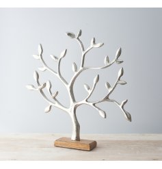  Sure to add a rustic charm to any home space with a similar setting, a silver toned aluminium tree ornament on a block 