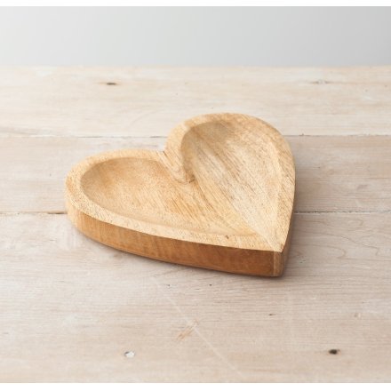 A simplistic natural wood heart dish, 