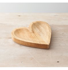 A simplistic natural wood heart dish, 