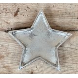 An overly distressed aluminium star plate, perfect for tlight use at Christmas 