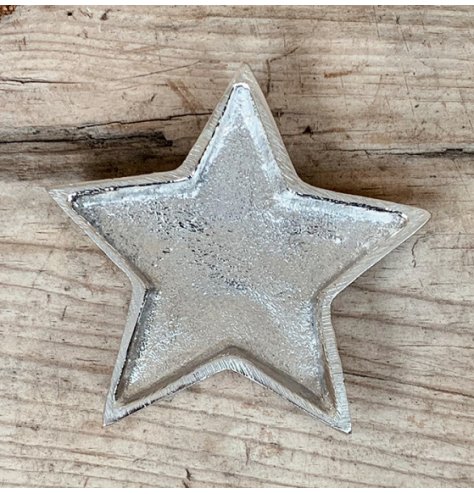 An overly distressed aluminium star dish, perfect for tlight use at Christmas 