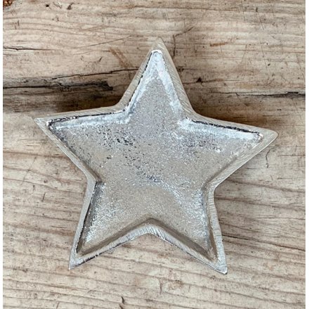An overly distressed aluminium star dish, perfect for tlight use at Christmas 