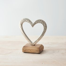 A small aluminium heart with a hammered effect and silver tone 