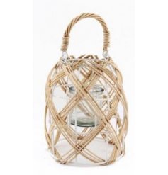 A woven lantern featuring a Boho inspired decal and white wire framing 