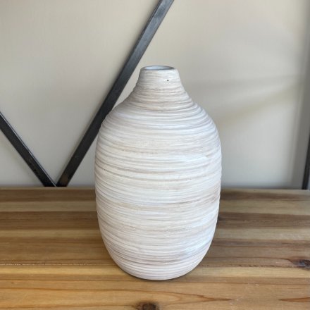 A charmingly simple standing stoneware vase set with a ribbed touch and natural colour tone 