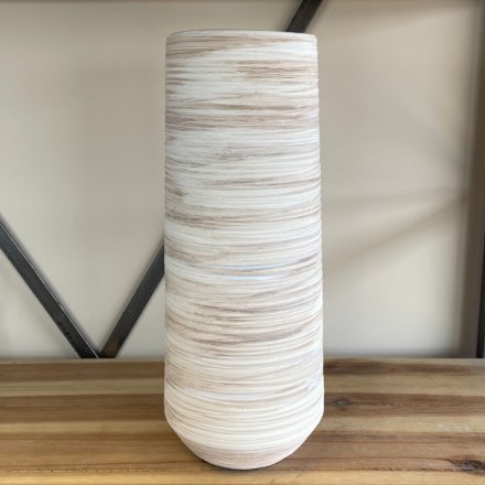 An tall standing ribbed vase with a neutral colour tone and a rustic finish 