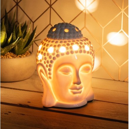 A buddha inspired Aroma Wax Burner with a warm glowing LED Centre and sleek white inspired tone 