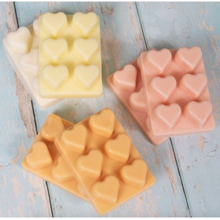 6 assorted wax melt hearts that are sweetly scented.