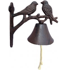 A beautifully detailed cast iron rope bell with perched bird decals and a rustic charm 