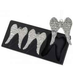 Covered with glitzy silver glitter, a set of 3 hanging glass angel wings with a shimmery touch 