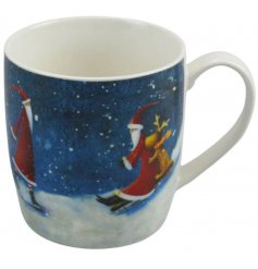 A festive themed porcelain mug featuring a sledding Santa decal 