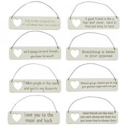 Small hanging signs with sentimental messages and cut out hearts.