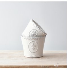 small dolomite pot with a smooth glaze finish, sleek white tone and embossed fleur de lis decal 