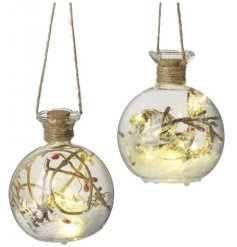 An assortment of hanging LED Glass Baubles filled berries and twigs 