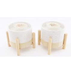  Each filled with a delightfully fresh fragranced wax, these speckle glazed candle pots feature a charming and simple co