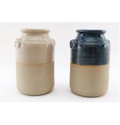   An assortment of porcelain based vases, both set with a ribbed edging and two tone finish 