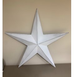 An Extra Large sized metal Barn Star set with a rustic white base tone and black lining 