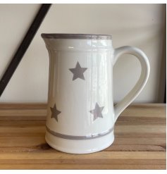 A charmingly simple ceramic jug featuring a grey ridge decal and added faded star print 