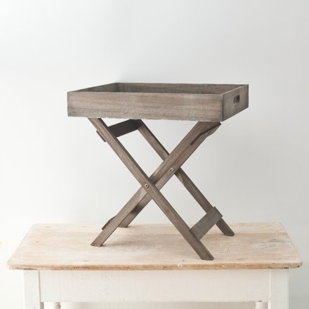 A stylish grey wooden table tray featuring a white washed tone and trendy look 