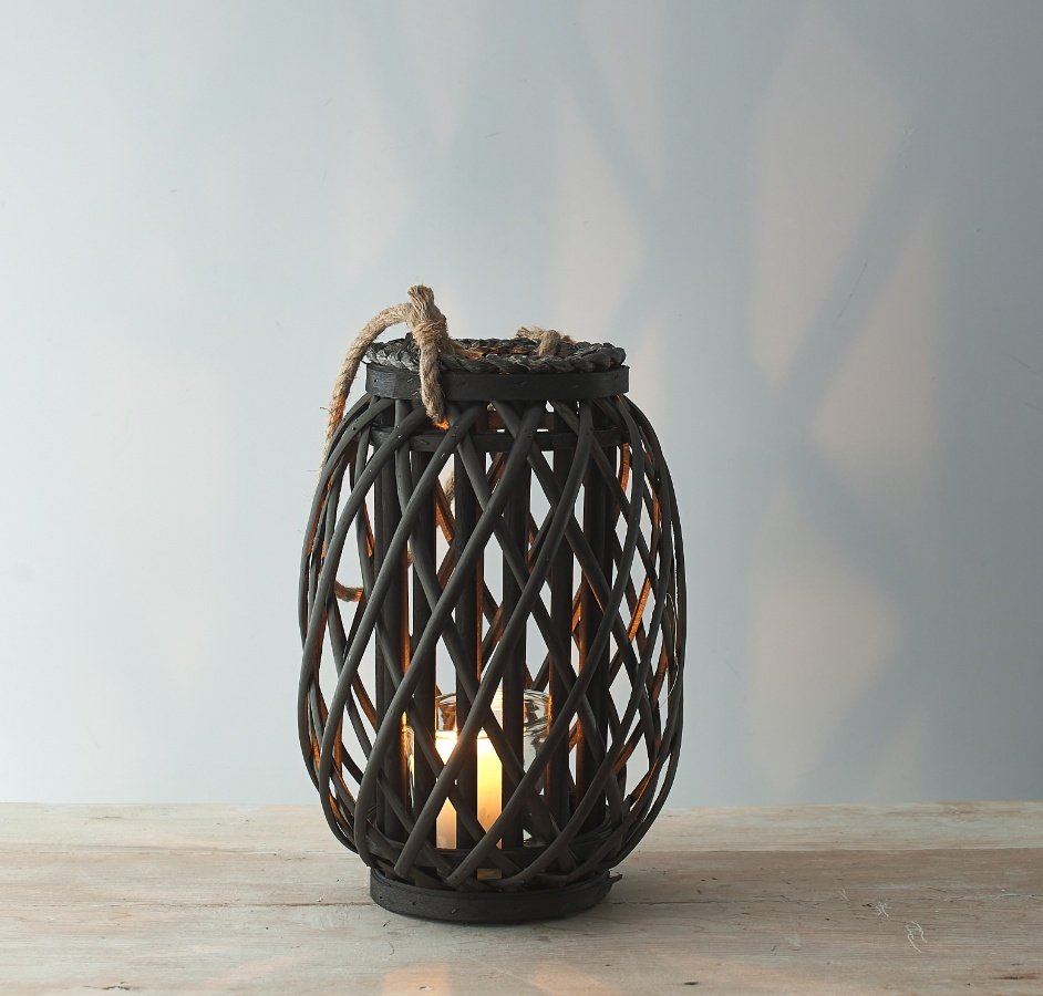 Perfect for adding a Rustic Charm to your living space, a tall standing wooden lantern with a lattice pattern and chunky