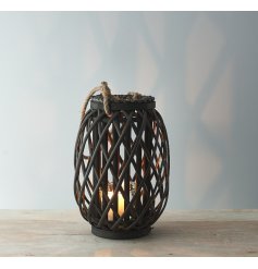 Perfect for adding a Rustic Charm to your living space, a tall standing wooden lantern with a lattice pattern and chunky