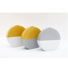 An assortment of block coloured toned vases in a rounded shape 