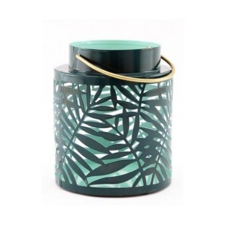  A beautifully designed metal lantern, set with a green tone and leaf cut decals surrounding it 