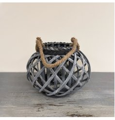  A small rounded lantern featuring a lattice willow decal and chunky rope handle 