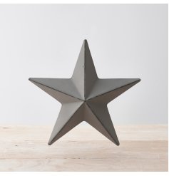 Perfect for bringing a Simplistic Twist to your interior, a grey toned metal barn star in a rustic form 