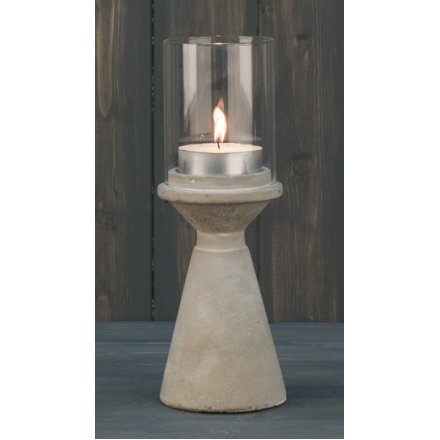 A sleek and simple themed concrete based candle holder, complete with a smooth finish and glass surround 