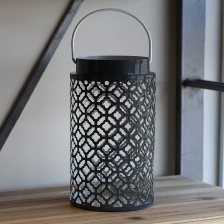  Sure to bring a modern and trendy touch to your home decor, a Navy Grey lantern with a Gatsby inspired cut 