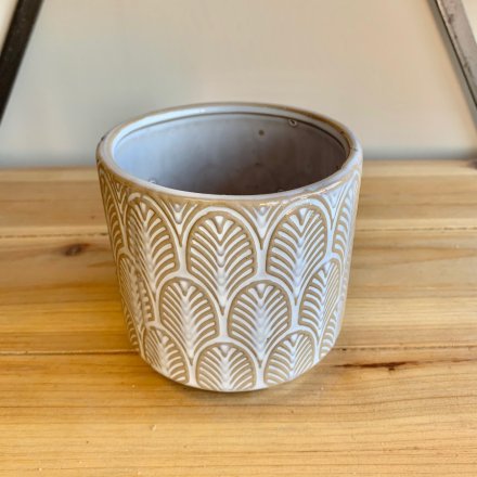 A charmingly simple themed ceramic decorative pot featuring an embossed patterned decal and rustic finish 