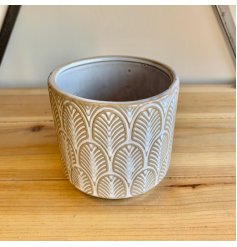 A charmingly simple themed ceramic decorative pot featuring an embossed patterned decal and rustic finish 