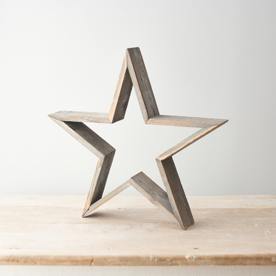 A large free standing wooden star set with a rustic tone and natural finish 
