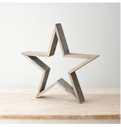 A large free standing wooden star set with a rustic tone and natural finish 